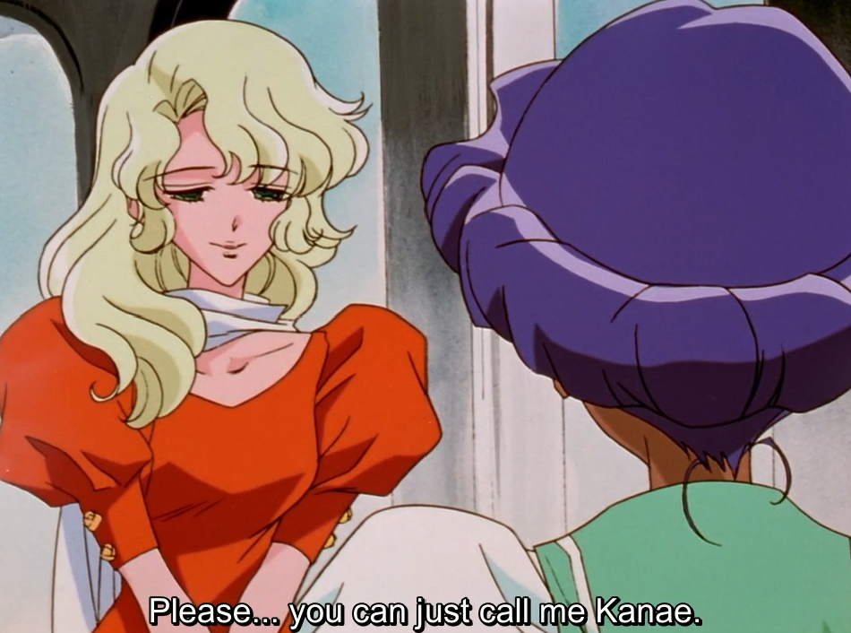 Kanae, with wavy blonde hair and an orange dress, smiles gently down at Anthy, who is seen from behind with her purple hair up. The subtitle reads “Please… you can just call me Kanae.”