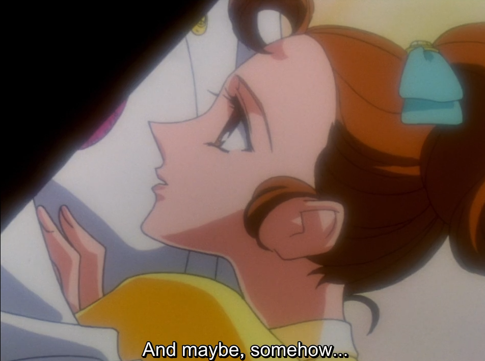 Wakaba, seen in close profile, gazes upward dreamily with her hand raised to her chest. The subtitle reads “And maybe, somehow…”