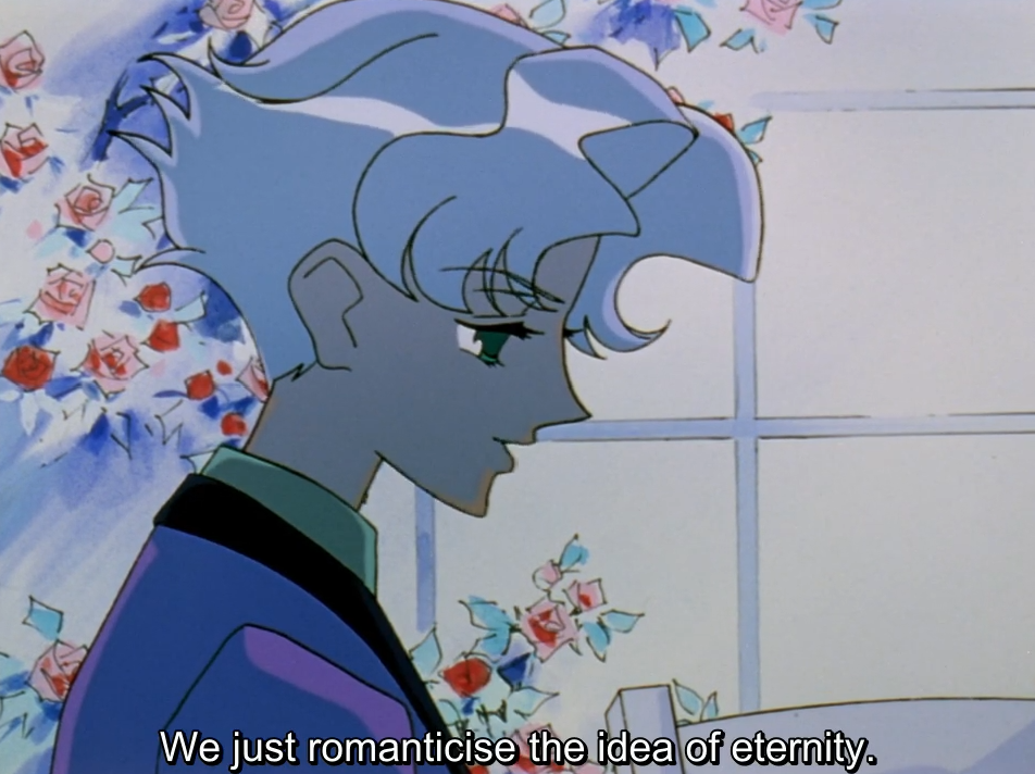 The same pale-haired young man in profile in the blue-tinted flashback, with roses and a window behind him. The subtitle reads “We just romanticise the idea of eternity.”