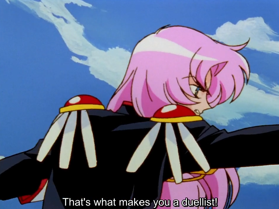 Utena, in their black duelling uniform with red and white epaulettes, seen from behind with arms outstretched against a blue sky, glancing back over their shoulder. The subtitle reads “That’s what makes you a duellist!”