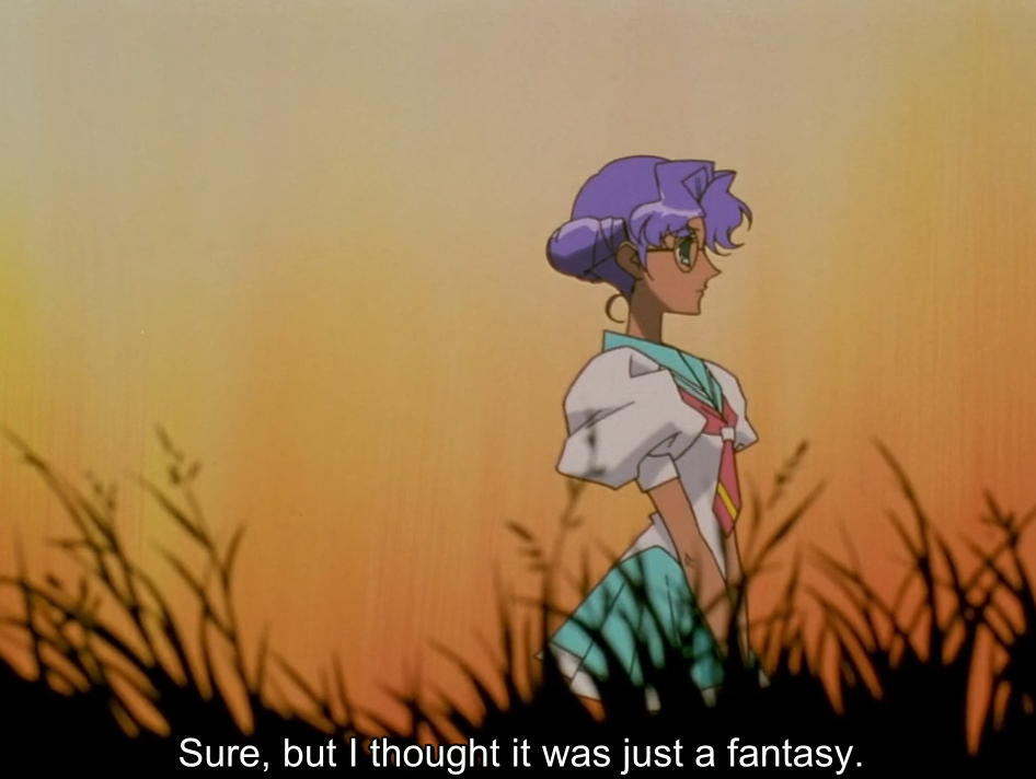 Anthy, in her school uniform and glasses, stands in profile amid tall grass silhouetted against an orange sunset. The subtitle reads “Sure, but I thought it was just a fantasy.”