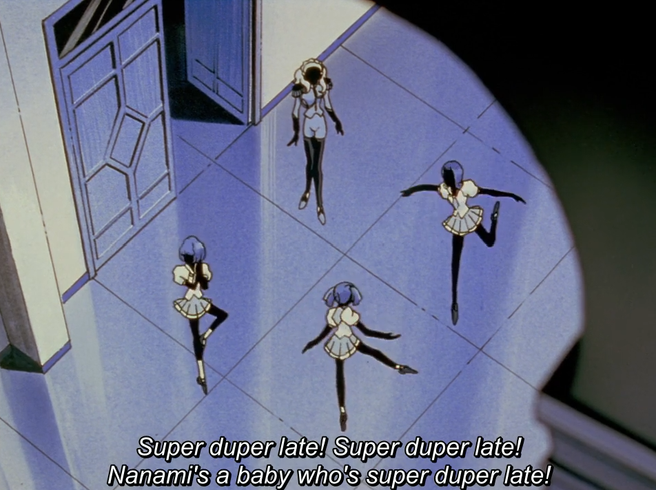 Seen from above through a circular vignette, four girls in matching uniforms dance and pose on a tiled floor beside a doorway. The subtitle reads "Super duper late! Super duper late! Nanami's a baby who's super duper late!"