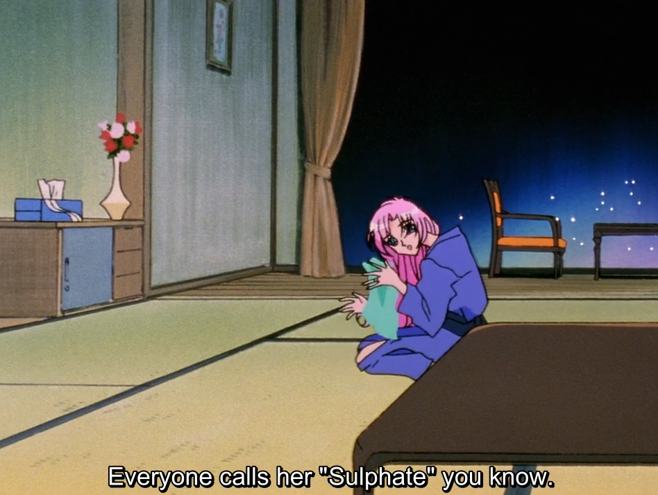 Anthy, in a blue yukata, kneels on the tatami floor of a traditional Japanese inn room at night, holding a cloth. The subtitle reads “Everyone calls her “Sulphate” you know.“
