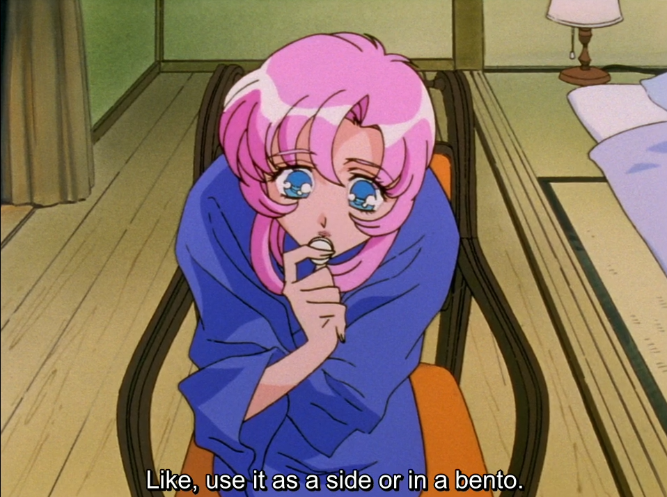 Utena, wrapped in a blue yukata and sitting in a chair in the inn room, nibbles on something with wide eyes. The subtitle reads “Like, use it as a side or in a bento.”