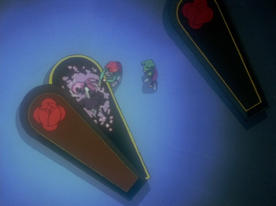 An overhead shot of black coffins marked with red rose crests; young Touga, with red hair, and young Saionji, with green hair, stand by an open coffin where a pink-haired girl lies among pale petals.